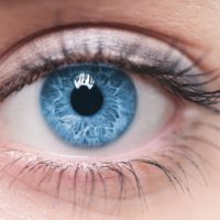 Extreme closeup of blue human eyeball showing the macula
